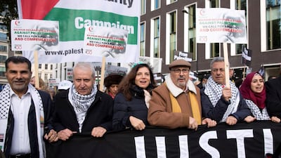 Palestinian ambassador to the UK Manuel Hassassian, third from right, joins a march through central London on November 4, 2017 to demand justice and equal rights for Palestinians. The march was held to coincide with the centenary of the Balfour Declaration that led to the creation of Israel. Isabel Infantes / Anadolu Agency / Getty Images
