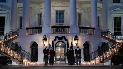 US President Joe Biden, first lady Jill Biden, Vice President Kamala Harris and husband Doug Emhoff hold a moment of silence and candlelight ceremony in honour of those who lost their lives to Covid-19 on the South Lawn of the White House in Washington, February 22, 2021. AFP