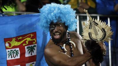 A Fiji fan celebrates his country's gold medal victory in rugby sevens at the 2016 Rio Olympics. Robert F Bukaty / AP Photo / August 11, 2016