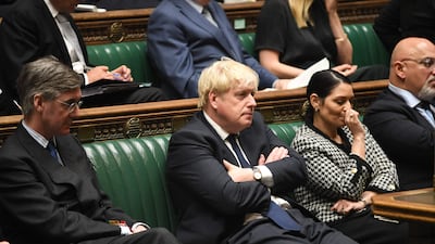 Britain's Prime Minister Boris Johnson, Britain's Home Secretary Priti Patel and Conservative MP Jacob Rees-Mogg. UK Parliament / AFP