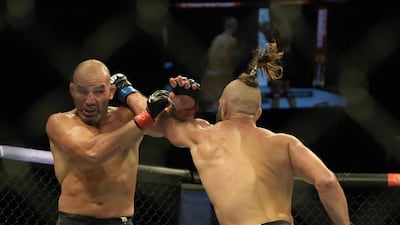 Jiri Prochazka throws a punch at Glover Teixeira during their light heavyweight title fight at UFC 275. AFP