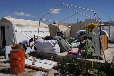 The Elias family dismantles the tent