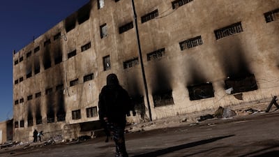 A Syrian woman searches for a family member, who was detained in Sednaya prison, north of Damascus. Reuters