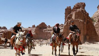 Horse and donkey rides are popular with tourists to the ancient city of Petra in Jordan. The site reopened in May after closure because of the coronavirus pandemic. AFP