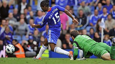 Florent Malouda scores Chelsea's sixth goal past West Bromwich Albion goalkeeper Scott Carson at Stamford Bridge yesterday.