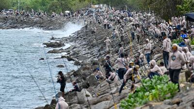 Anglers compete in a fishing competition at a beach in Banda Aceh, Indonesia. AFP