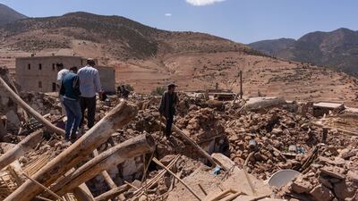 Villagers survey the rubble of destroyed buildings after the earthquake near Amizmiz. Bloomberg