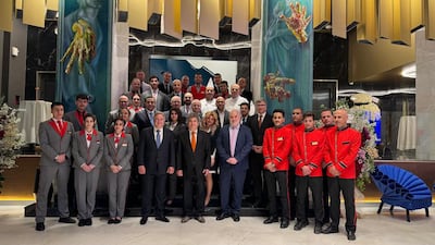 Mourhaf Nazha, fourth left, stands next to his brother, Mounzer, and members of staff at their Royal Semiramis hotel in Damascus. Photo: Mourhaf Nazha