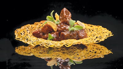 Stir-fried black pepper rib eye beef served in a basket made of shredded crispy prawn crackers. Photo: Hakkasan Abu Dhabi