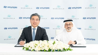 Waleed Al Muhairi, right, deputy group chief executive of Mubadala, and Jaehoon Chang, president and chief executive of Hyundai Motor, sign the agreement. Photo: Mubadala