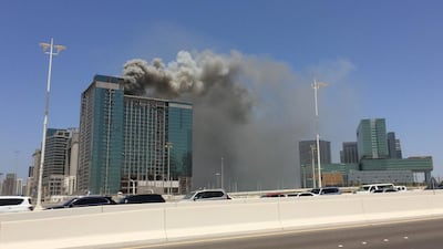 According to a construction worker, the fire at the under-construction building by the Beach Rotana hotel started at about 10.30am. Christopher Pike / The National