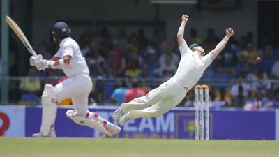 Australia’s Mitchell Marsh attempts to catch a ball off a shot played by Sri Lanka’s Dinesh Chandimal during the day one of their third test cricket match in Colombo, Sri Lanka. Eranga Jayawardena / AP photo