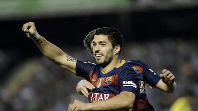 Barcelona’s Uruguayan forward Luis Suarez celebrates after scoring a goal during the Spanish league football match Real Betis and Barcelona at the Benito Villamarin stadium in Sevilla on April 30, 2016. Cristina Quicler / AFP