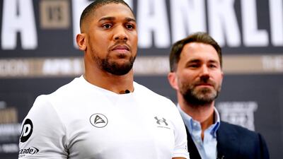 Anthony Joshua and promoter Eddie Hearn during a press conference at the Hilton London Syon Park. PA