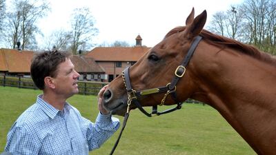 Trainer Graham Motion, pictured in April 2013 with Animal Kingdom at Kingsdown Stables in Lambourn, England, is among those attempting to get furosemide banned from use in US horse racing. Courtesy Geoffrey Riddle