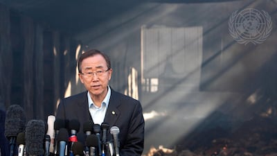 Secretary-General Ban Ki-moon addresses a press conference in front of the damaged warehouse building of the headquarters of the United Nations Relief and Works Agency for the Palestine Refugees in the Near East.
