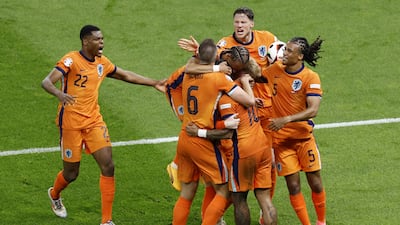 Stefan de Vrij celebrates with his Dutch teammates after making it 1-1. EPA