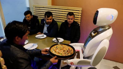 Timea brings food to a table at the Times Fast Food restaurant in Kabul, Afghanistan. Reuters