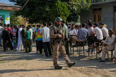 An Indian soldier guards a polling station north of Srinagar, in Jammu and Kashmir. AP
