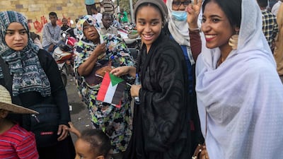 In the clips and photos, Saleh stands atop a car wearing a long white headscarf and skirt as she sings and works the crowd. AFP