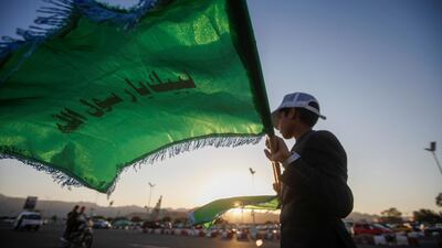 A boy holds a flag in preparation for the celebration of the birth anniversary of Islam's Prophet Mohammad in Sanaa, Yemen November 1, 2019. Reuters