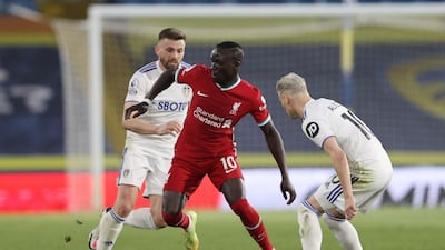 Liverpool's Sadio Mane in action with Leeds United's Ezgjan Alioski and Stuart Dallas. Reuters