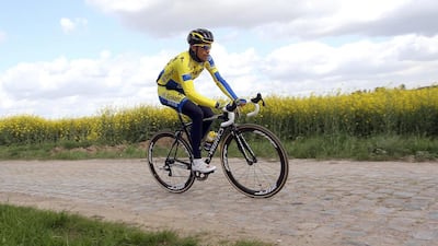 Spanish cyclist Alberto Contador of the Tinkoff-Saxo team rides during a training session on the cobblestones between Ypres and Arenberg-Les Portes du Hainaut in northern France, 14 April 2014, in preparation of stage 5 of the 2014 Tour de France cycling race. EPA/EDDY LEMAISTRE
