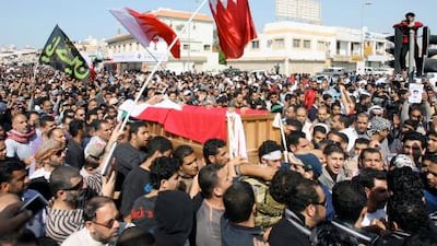 Bahraini Shiite protesters carry the coffin of a comrade who died following clashes with police.
