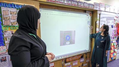 Teachers’ roles have evolved in response to digitised classrooms. Victor Besa / The National