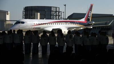 A Mitsubishi Regional Jet (MRJ) moves into the hanger at the ceremony at the Nagoya airport in Komaki. Toshifumi Kitamura / AFP