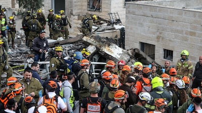 Emergency personnel work at the site of an Iranian strike in Beit Shemesh, Israel. Reuters