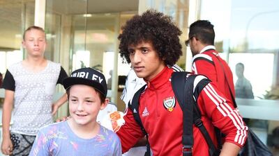 A young fan takes a picture with Abdulrahman. The midfielder has been one of the stars of the Asian Cup.