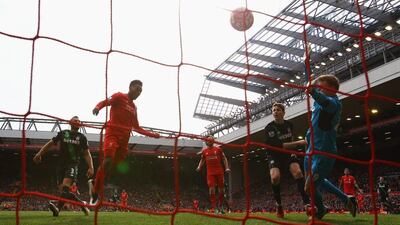 Daniel Sturridge of Liverpool (2L) scores their second goal with a header past goalkeeper Jakob Haugaard of Stoke City during the Premier League match between Liverpool and Stoke City at Anfield on April 10, 2016 in Liverpool, England. (Photo by Clive Brunskill/Getty Images)