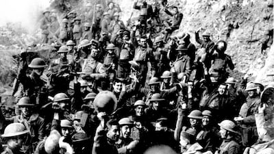 American troops, near St. Mihiel, France, cheer after hearing the news that the Armistice has been signed.
