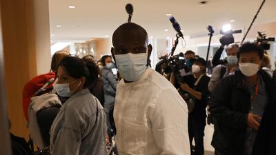 Lassana Bathily, the employee of the Hyper Cacher supermarket who helped shoppers to hide in a cold storage room from a gunman arrives at Paris' courthouse, for the opening hearing of the trial of 14 suspected accomplices in Charlie Hebdo and Hyper cacher jihadist killings. AFP