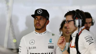 Lewis Hamilton of Great Britain and Mercedes GP talks to his engineer, Peter Bonnington in the garage during qualifying for the Formula One Grand Prix of China at Shanghai International Circuit on April 16, 2016 in Shanghai, China. (Photo by Mark Thompson/Getty Images)