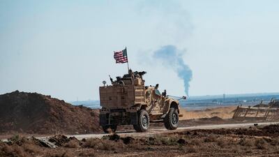 A US armoured vehicle patrols the village of Ein Diwar in Syria's northeastern Hasakeh province. AFP