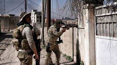 Iraqi troops patrol areas retaken from ISIL in western Mosul on March 9, 2017. Aris Messinis / AFP