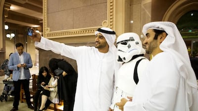 A pair of Emirati men take a selfie with a stormtrooper ahead of the Star Wars: The Force Awakens, Middle East premiere at Emirates Palace in Abu Dhabi. Christopher Pike / The National