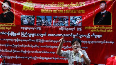 A candidate of Democracy Party for a New Society talks with microphone during an election campaign rally at downtown area in Yangon, Myanmar on Sunday. EPA