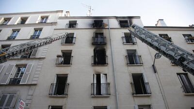 Rescue workers ladders against the damaged building. Francois Mori / AP Photo