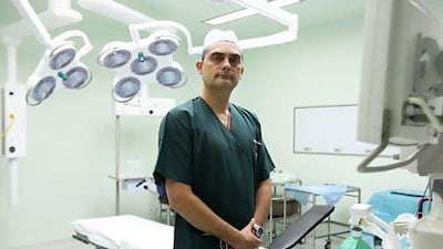 Dr Dejan Stepic, a general surgeon at the Medcare Hospital in Dubai, says it's important to strike a balance between imparting information and being sensitive to a patient's background. Pawan Singh / The National