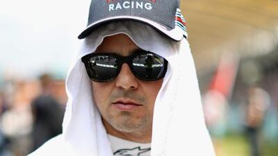 Felipe Massa of Brazil and Williams on the grid before the Malaysia Formula One Grand Prix at Sepang Circuit. Mark Thompson / Getty Images