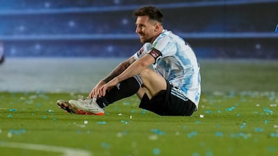 Argentina's Lionel Messi sits on the field during a qualifying soccer match against Brazil for the FIFA World Cup Qatar 2022 at Bicentenario stadium in San Juan, Argentina, Tuesday, Nov. 16, 2021. (AP Photo / Natacha Pisarenko)