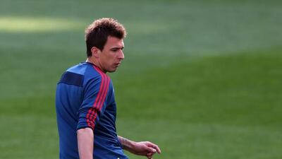 Mario Mandzukic runs with the ball during their FC Bayern Muenchen training at the Santiago Bernabeu Stadium ahead of the UEFA Champions League semi-final first leg match against Real Madridon April 22, 2014 in Madrid, Spain. Martin Rose/Bongarts/Getty Images