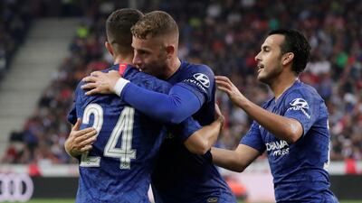 Pulisic is congratulated by teammates. Reuters