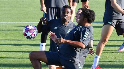 Juventus' Juan Cuadrado, front, training with teammates. EPA