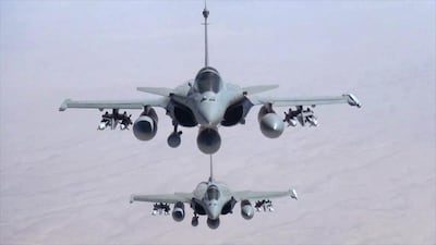 This remote camera screen grab photo provided on September 19 by the French Army's video and photo department ECPAD shows two Rafale jet fighters fly over Iraq. AP Photo