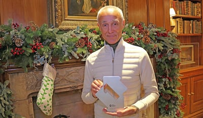 Andrew Ridgeley of Wham! with the Official Charts Company trophy for Christmas No 1. PA Images