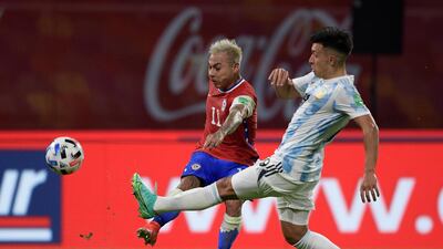 Argentina's Lisandro Martinez attempts a block against Chile's Eduardo Vargas. EPA